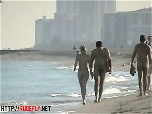 voyeurism at a super-steamy nudist duo on the beach
